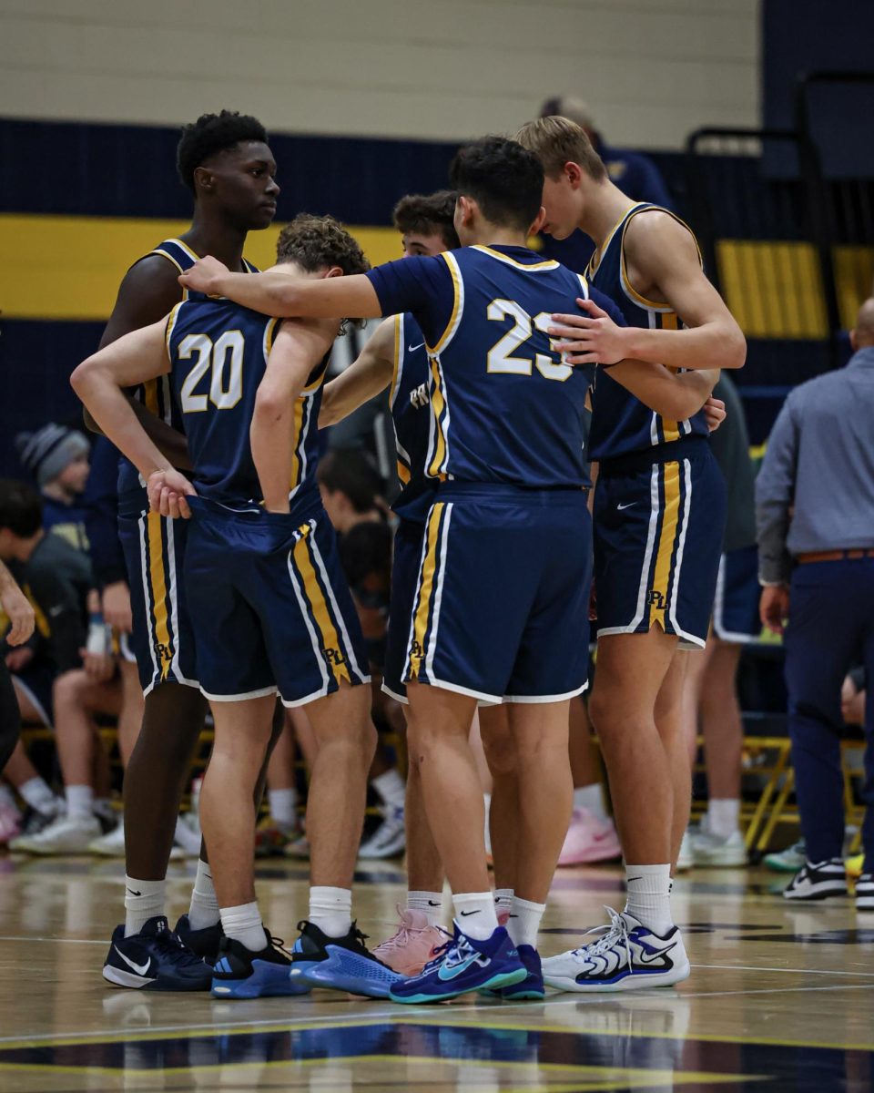 Members of the Prior Lake boys basketball team huddle up during their game against Burnsville on Jan. 10, 2025, at Prior Lake High School. The Lakers beat the Blaze, 75-61. Submitted photo/Caty Mawing Photography