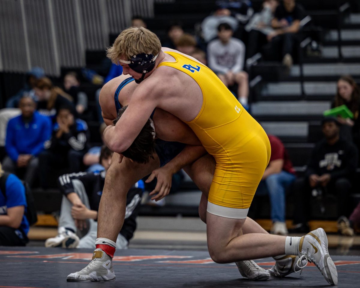 Brock Zurn grapples his opponent during the section 2AAA individual tournament in Farmington on Feb. 22. Courtesy photo/Caty Mawing Photography