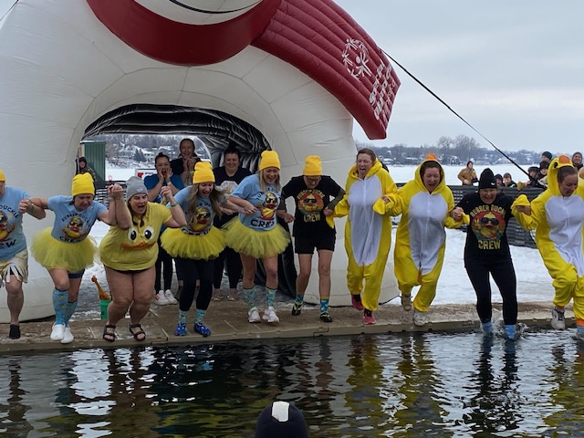 The Rubber Duckies linked arms before hitting the water.