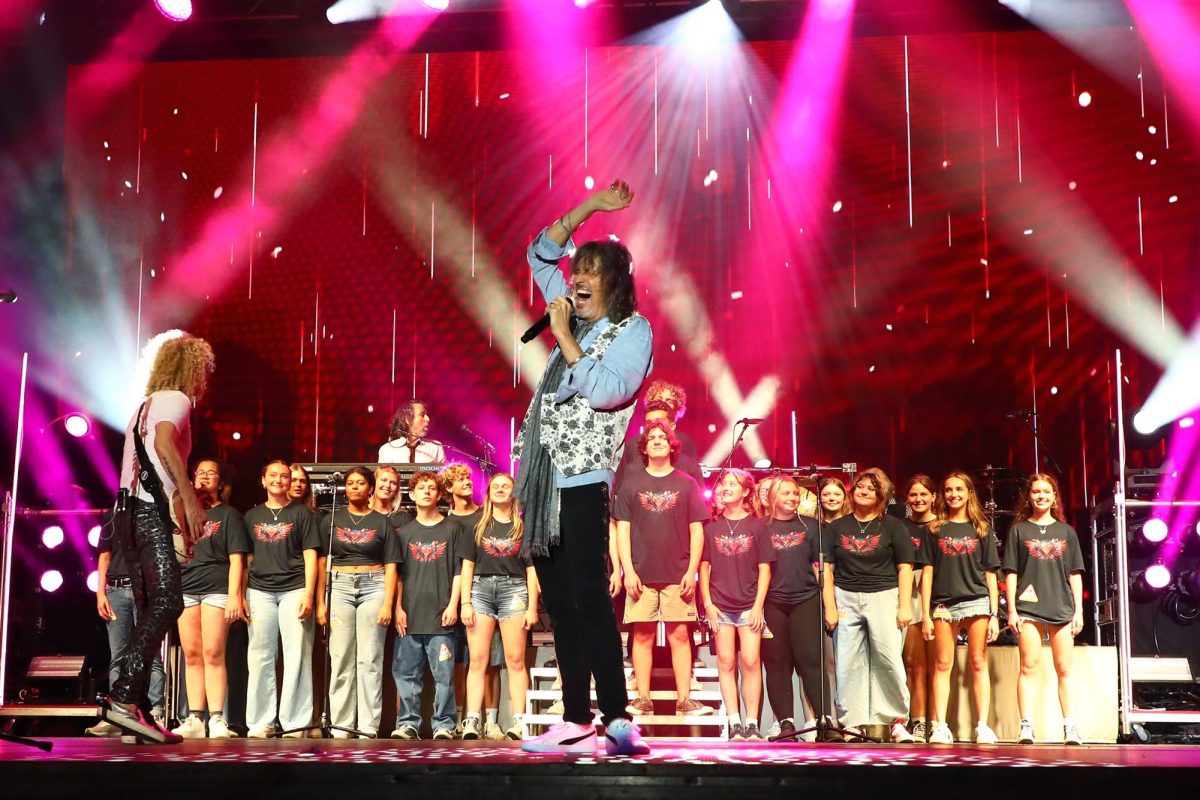 Members of the Prior Lake High School Choir joined Foreigner's Kelly Hansen on stage to perform "I Want to Know What Love Is."