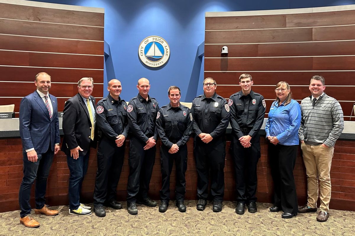 Members of the Prior Lake City Council congratulated two firefighters receiving promotions and three new members joining the department. From left to right are: Councilmember Victor Lake, Mayor Kirt Briggs, Jake Theisen/Assistant Fire Chief & Fire Marshall, Brandon Anderson/Captain, new firefighters Blake Lawrence, Spenser Smith and Andrew Smith, Councilmember Kimberly Churchill and Councilmember Ethan Hellier.