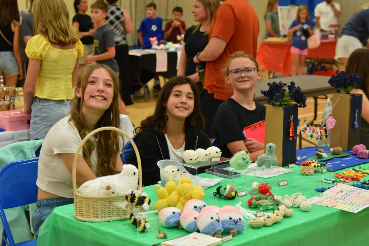 Madelyn Michels, Rose Beuch-Wollner and Isa Lea display the creations they had for sale at the Youth Art & Craft Market. (Photo provided by PLSAS.)