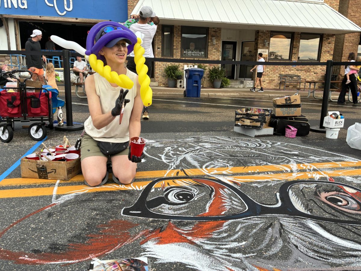 Professional chalk artist Allison Severson drew many spectators as she created a work of art on Main Avenue.