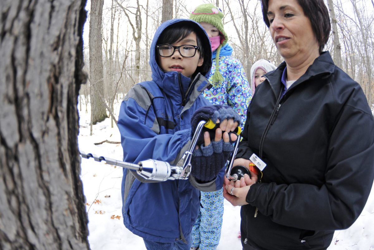 Participants learn about maple sugaring at Cleary Lake. Courtesy photo / Derek J. Dickinson