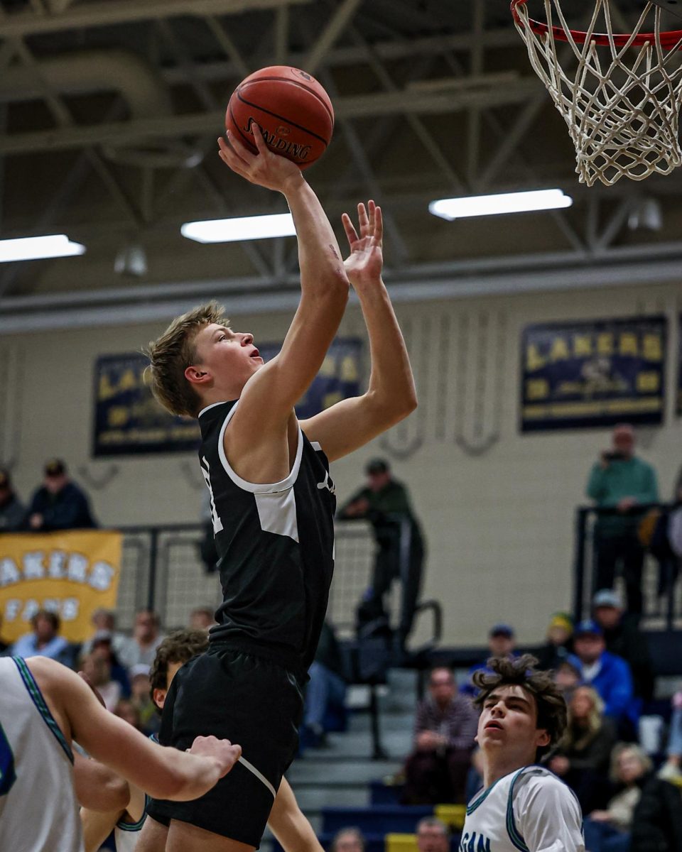 Colten Gunderson rises for a shot against Chanhassen in the section 2AAAA playoffs on March 5, 2025. Courtesy photo / Caty Mawing Photography