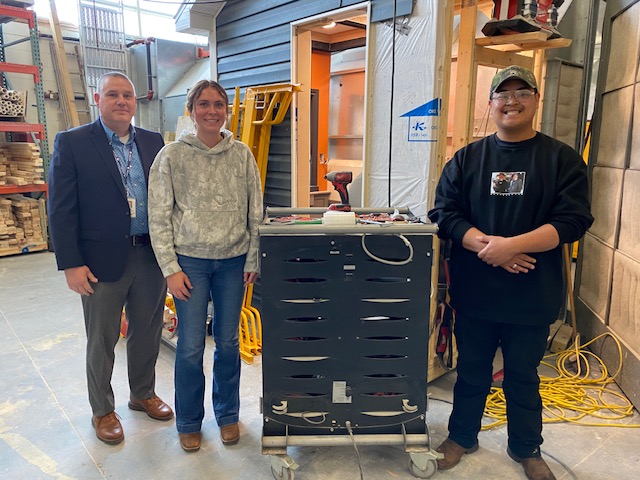 Brian Nutter (left), assistant principal and leader of the MnCAPS program at Prior Lake High School, visited with students Danea Dahlberg and Sean Souriya, participants in the construction trades pathway during the 2024-25 school year. Laurie Hartmann / PL News Compass