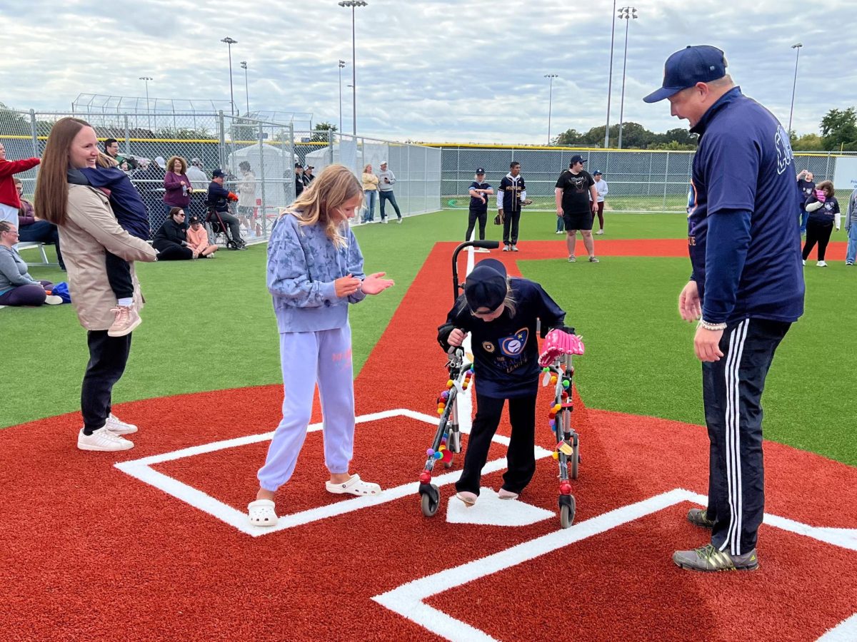 This child was cheered on by family members while crossing home plate. (Photos by Maggie Stanwood)