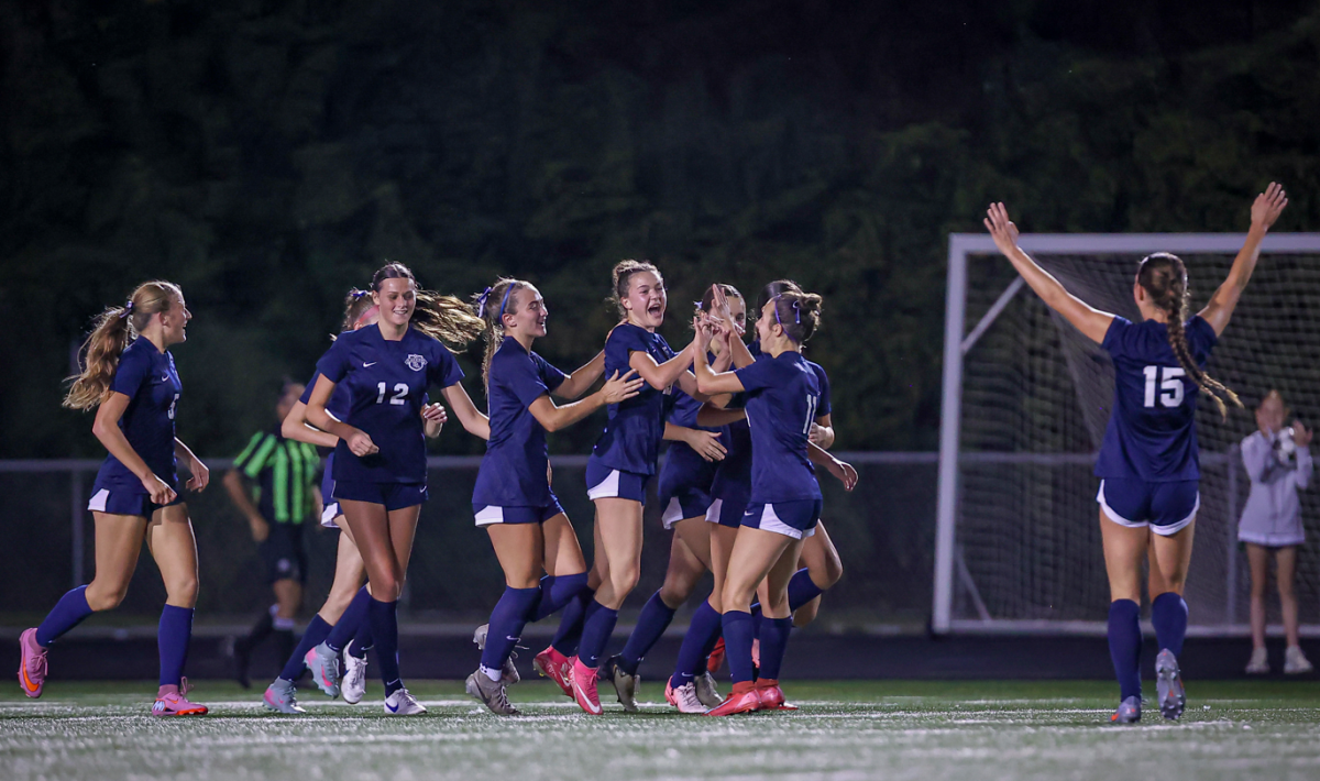 Mila Macias celebrates with team members after scoring a goal against Shakopee. (Caty Mawing Photography)
