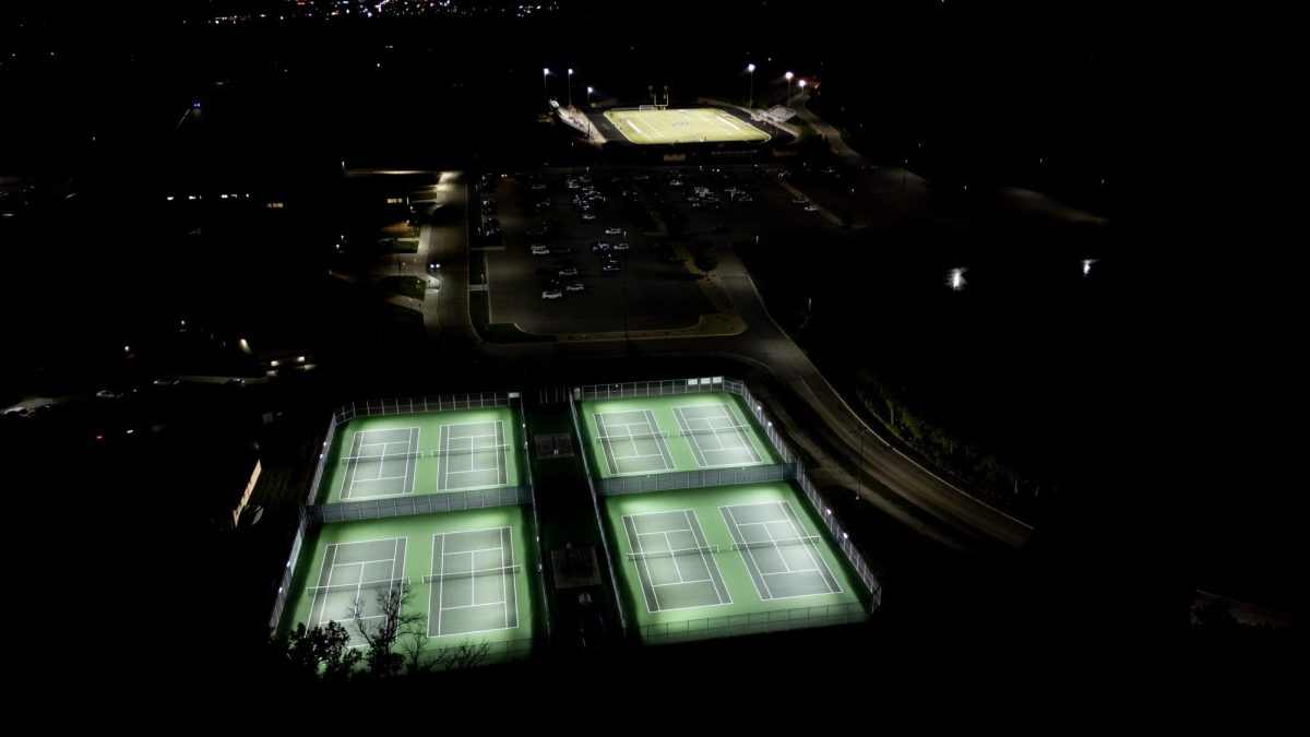 Eight tennis courts at Prior Lake High School now have lighting, with Dan Patch Stadium shown in the background.