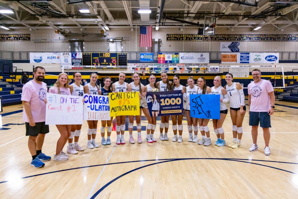 Laker team members rallied around Ryah Cotton after she recorded her 1,000th career dig.