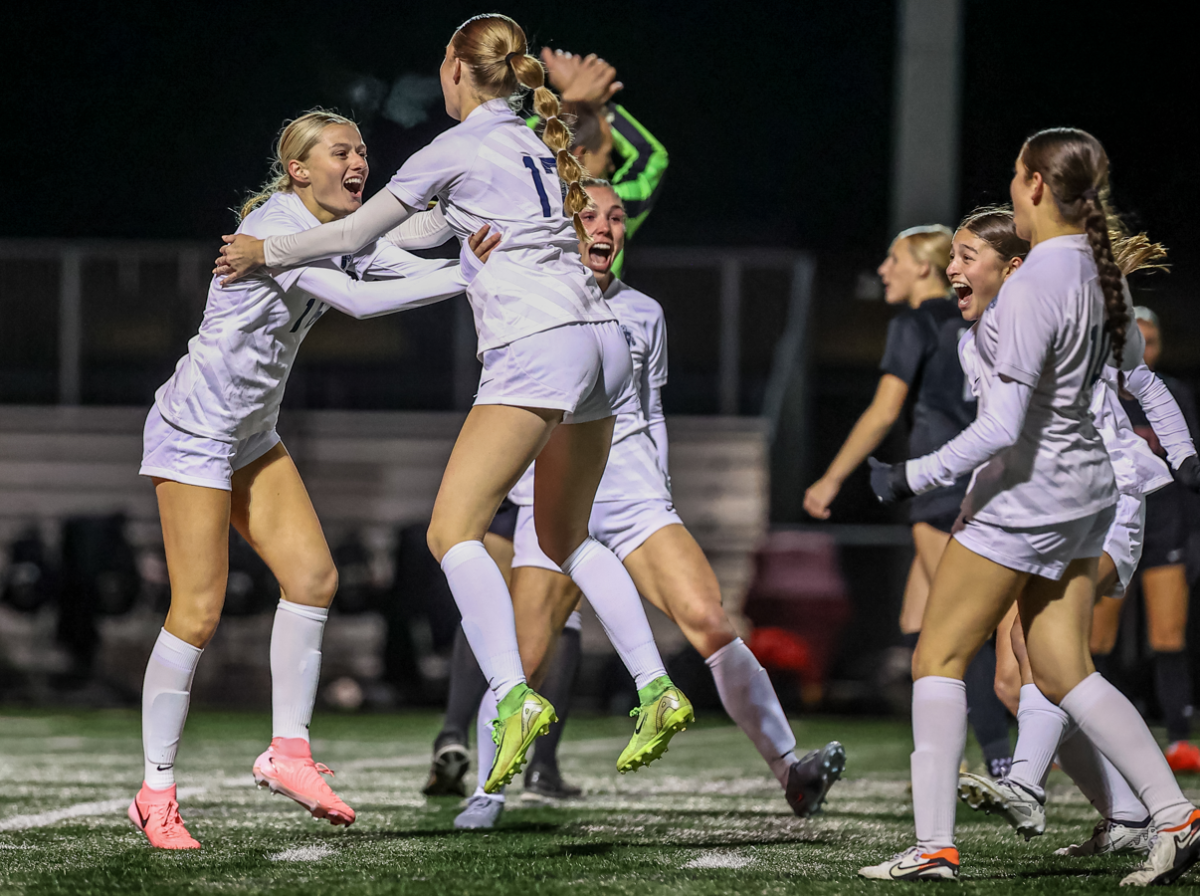 Lauren Schindler (#16) celebrates her goal in the state tournament quarterfinal game against Lakeville North. (Photo by Caty Mawing Photography)