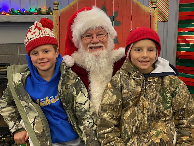 Santa had the opportunity for an early visit during last year's DecemBRRR Dazzle event with Brady (left) and Ryan Groth.