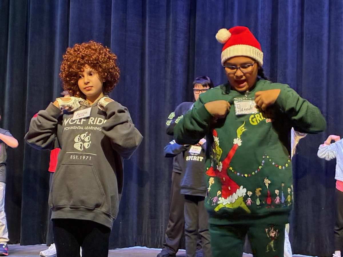Amelia Mauricio (left) has the leading role in "Annie Jr.," and supported by her mentor, Hannah Knutson.