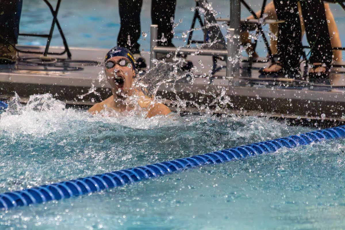 Lakers swimming and diving senior captain Owen Beaudette after breaking the Eagan pool record in the 100-yard breaststroke on Dec. 5, 2025. (photo by Brayden Lillemoen)
