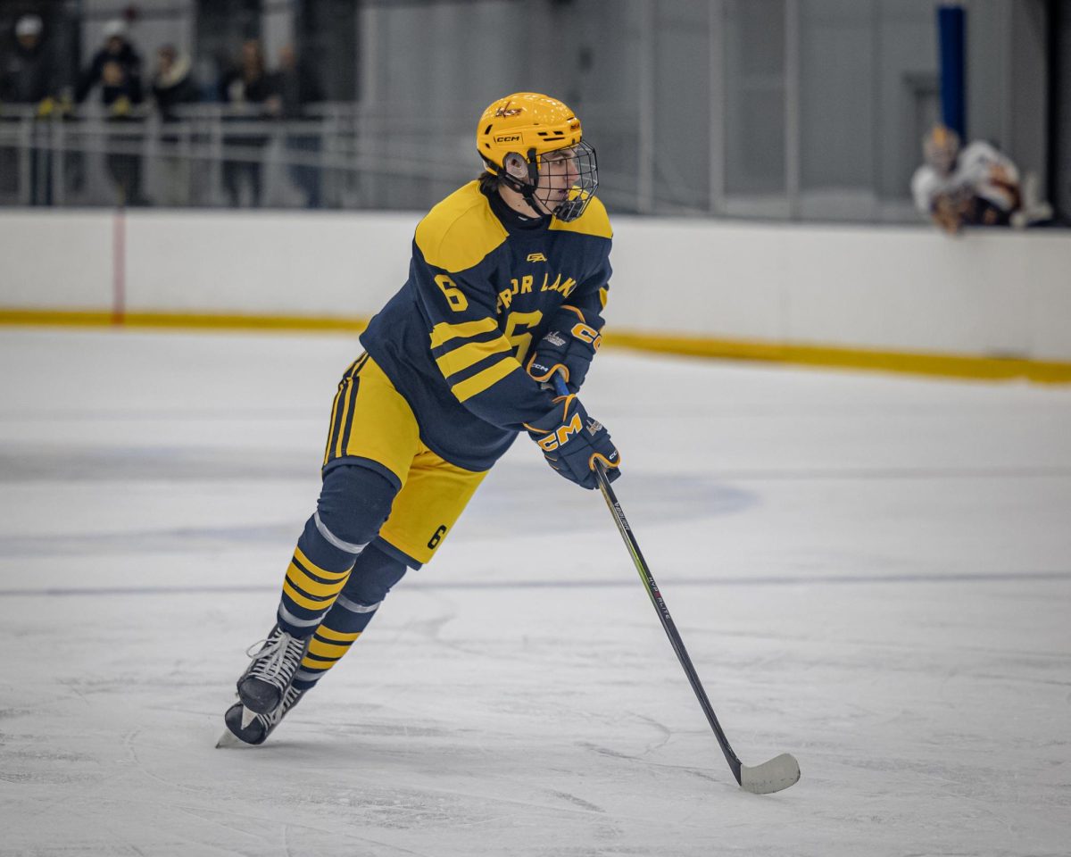 Prior Lake boys hockey senior forward Hudson Young, pictured here during a Jan. 2 game against Cretin-Derham Hall, scored his first varsity goal Jan. 10 in an away loss to Eastview. (photo by Caty Mawing)