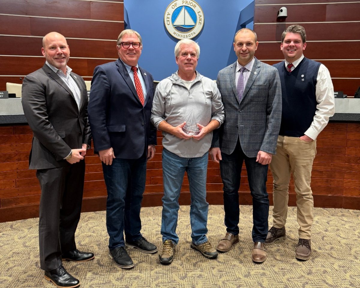 Planning Commission member Dan Ringstad (center) was honored for his 20 years of service by council members (from left to right), Zach Braid, Mayor Kirt Briggs, Victor Lake and Ethan Hellier.