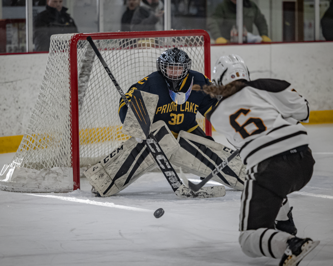 Lakers girls hockey senior goalie Sophie Cappiello takes on a shot from Apple Valley. (photo by Caty Mawing)