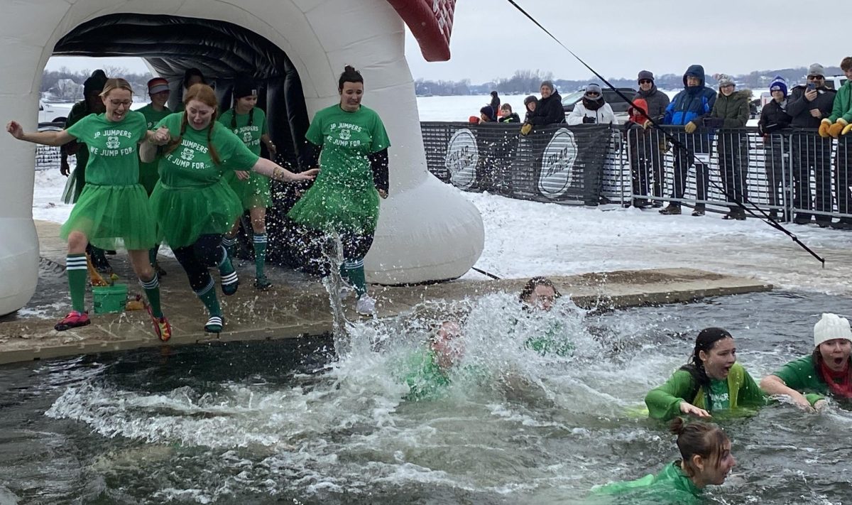 Those who signed up for the 2025 Polar Plunge at Sand Point Beach prepared themselves for hitting the water.