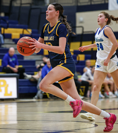 Toni Fisher drives to the hoop. (Caty Mawing Photography)