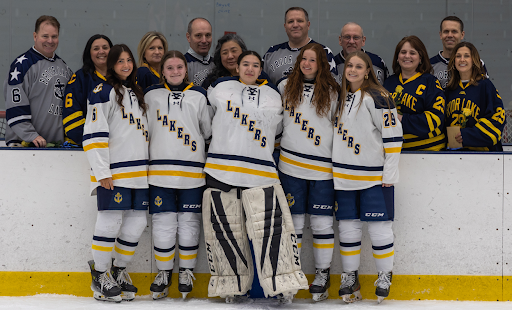 Seniors Ava Anderson, Ella Bloom, Sophie Cappiello, Ciera Olinger, and Paige Watkins with their families on Senior Night (Photo by Caty Mawing Photography)