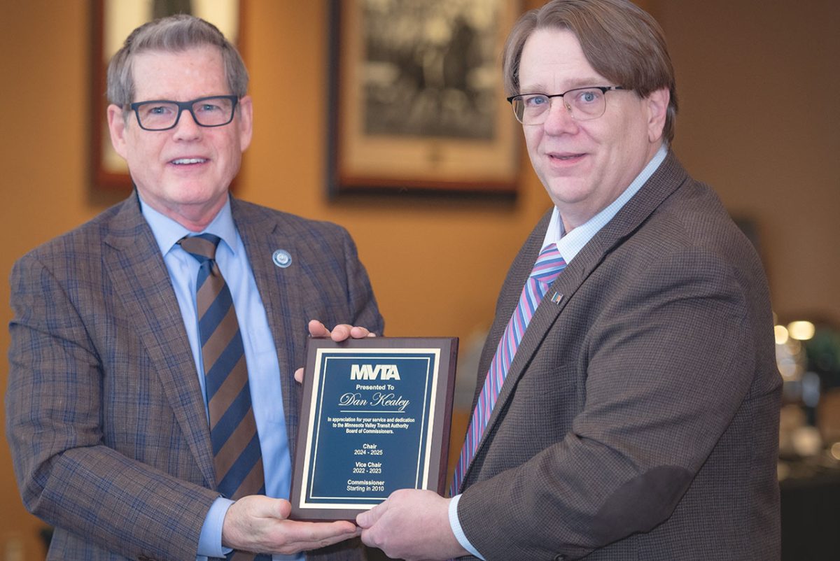 Dan Kealey, at left, receives a recognition plaque from incoming MVTA Board Chair Jay Whiting at the January meeting of the MVTA Board of Commissioners.