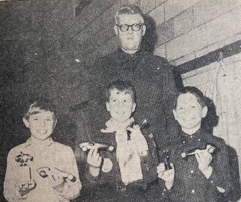 Prior Lake Cub Scouts competing in the city's first annual Pinewood Derby in early February of 1966 were presented trophies by the event's official judge, Mayor Melvin Borchardt. Winners were, from left to right, Mike Miller, first place; Scott Carlson, second place and best appearance award; and Ronald Loftus, third place. Forty-four cars were entered in the derby.