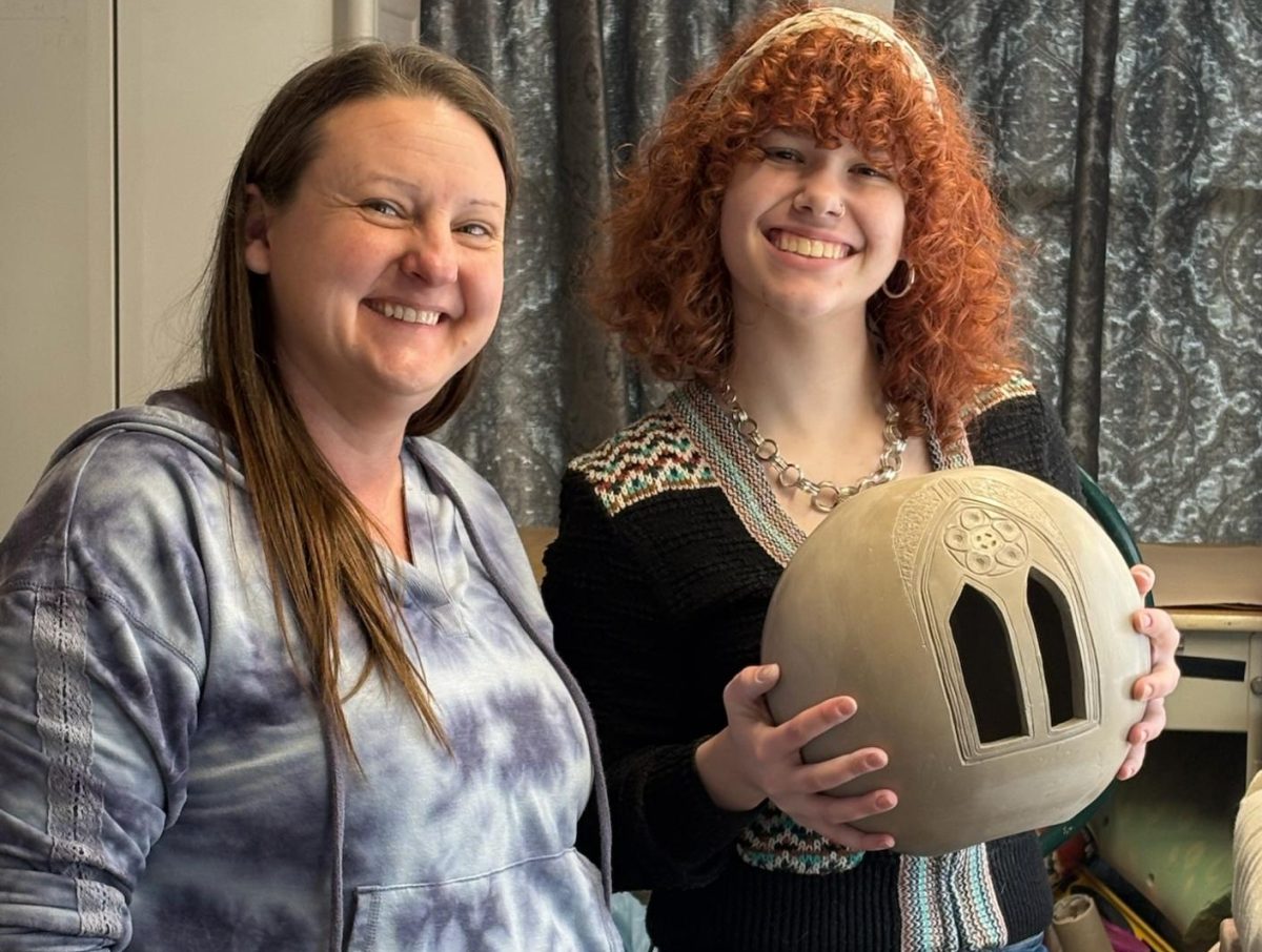 Prior Lake artist Andrea Mullenmeister (left )and Mags.