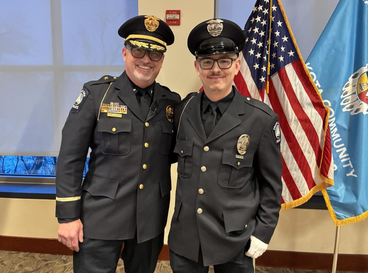 Police Chief Liam Duggan (left) and the city's newest officer, Brady Gaebel.