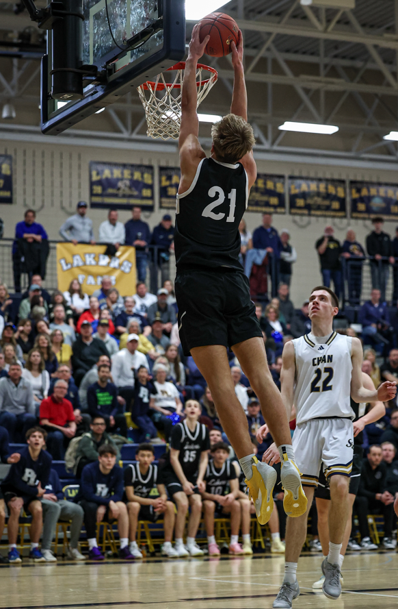 Colton Gunderson goes up for a dunk against Chanhassen (Photo by Caty Mawing Photography)
